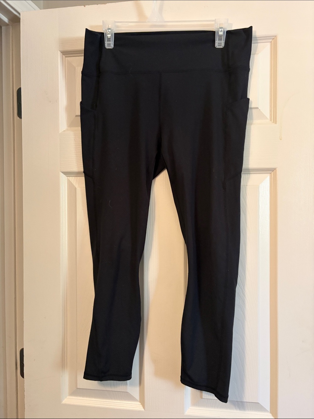 Fabletics Black High-Rise Capri Leggings with Side Pockets